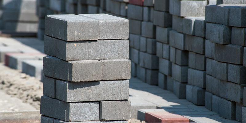 Rows of newly made bricks stacked in the open air to cure at a brickworks in India.